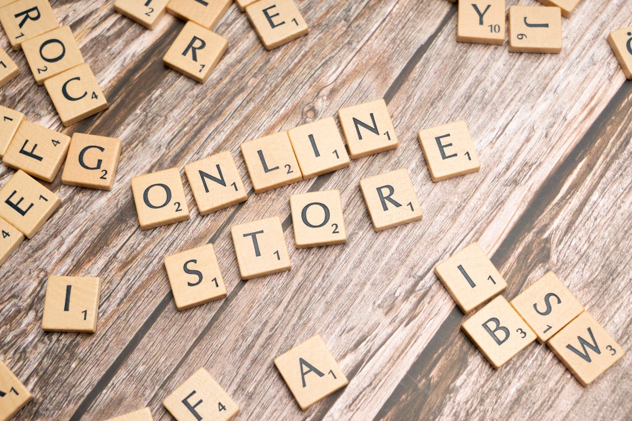 Scrabble tiles spelling 'online store' on a rustic wooden background.